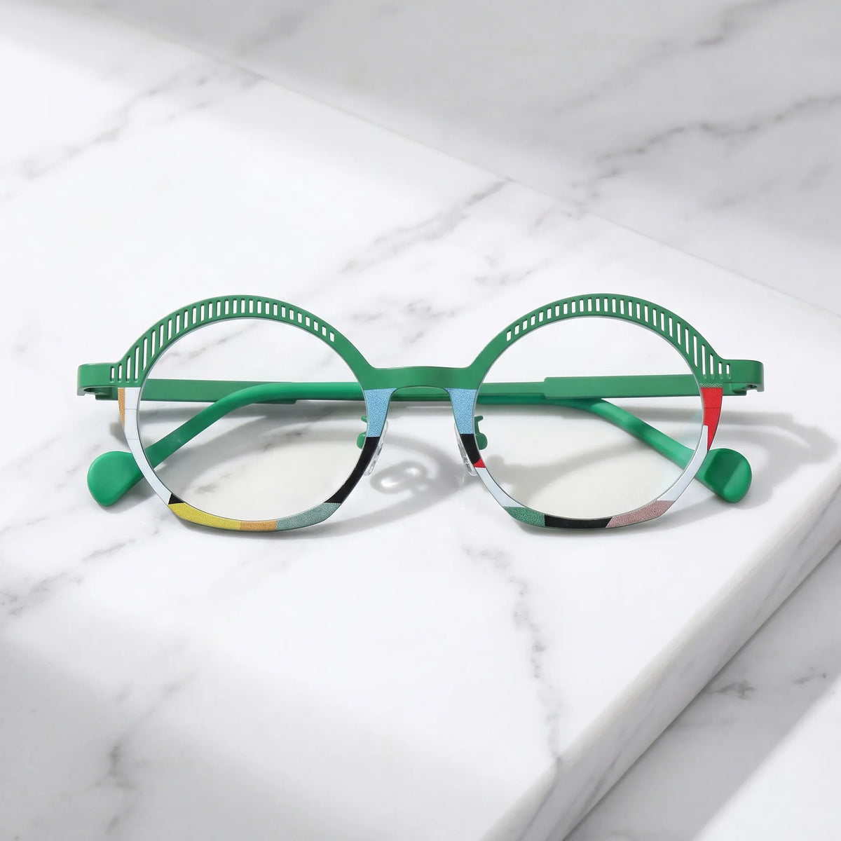 arledear Meadow Mosaic eyeglasses folded display showing slim green titanium temples, clear nose pads, and lightweight frame structure