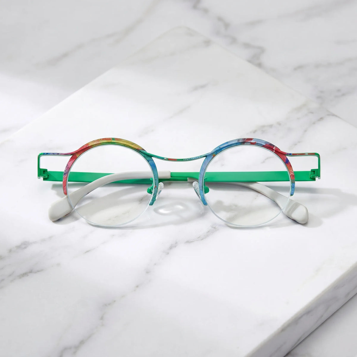 Barledear Meadow Splash eyeglasses folded display showing slim titanium temples and multicolor artistic surface finish