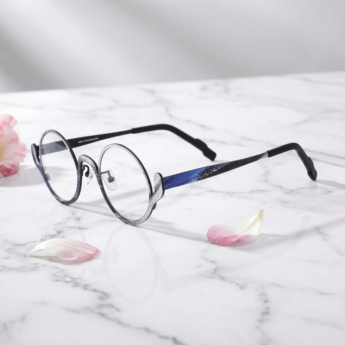 Barledear Midnight Graphite eyeglasses angled side view showing slim temples, adjustable nose pads, and a lightweight round full-rim titanium frame