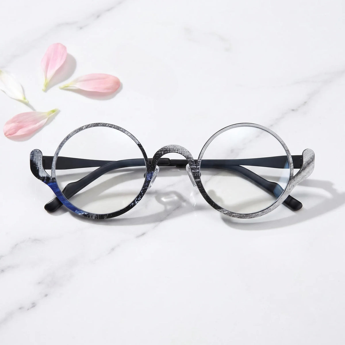 arledear Midnight Graphite eyeglasses folded display showing the round frame shape, slim temples, and artistic color-spliced pure titanium construction