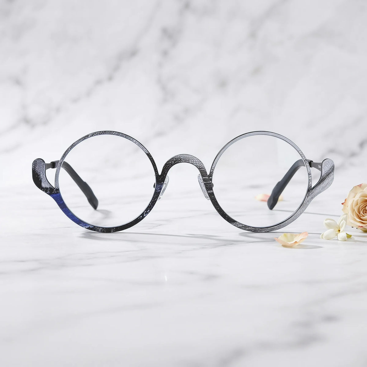 Barledear Midnight Graphite eyeglasses shown in a clean lifestyle front view highlighting the artistic round pure titanium frame and modern everyday style