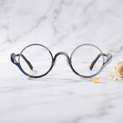 Barledear Midnight Graphite eyeglasses shown in a clean lifestyle front view highlighting the artistic round pure titanium frame and modern everyday style