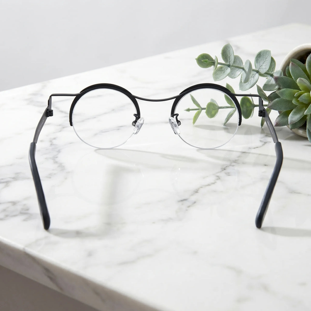 Barledear Midnight Marble eyeglasses back view showing adjustable nose pads, slim temples, and lightweight pure titanium construction