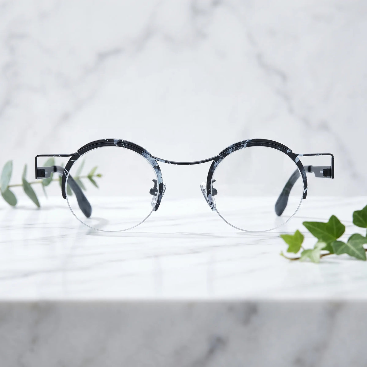 Barledear Midnight Marble eyeglasses shown in a clean lifestyle front view with black white artistic frame details