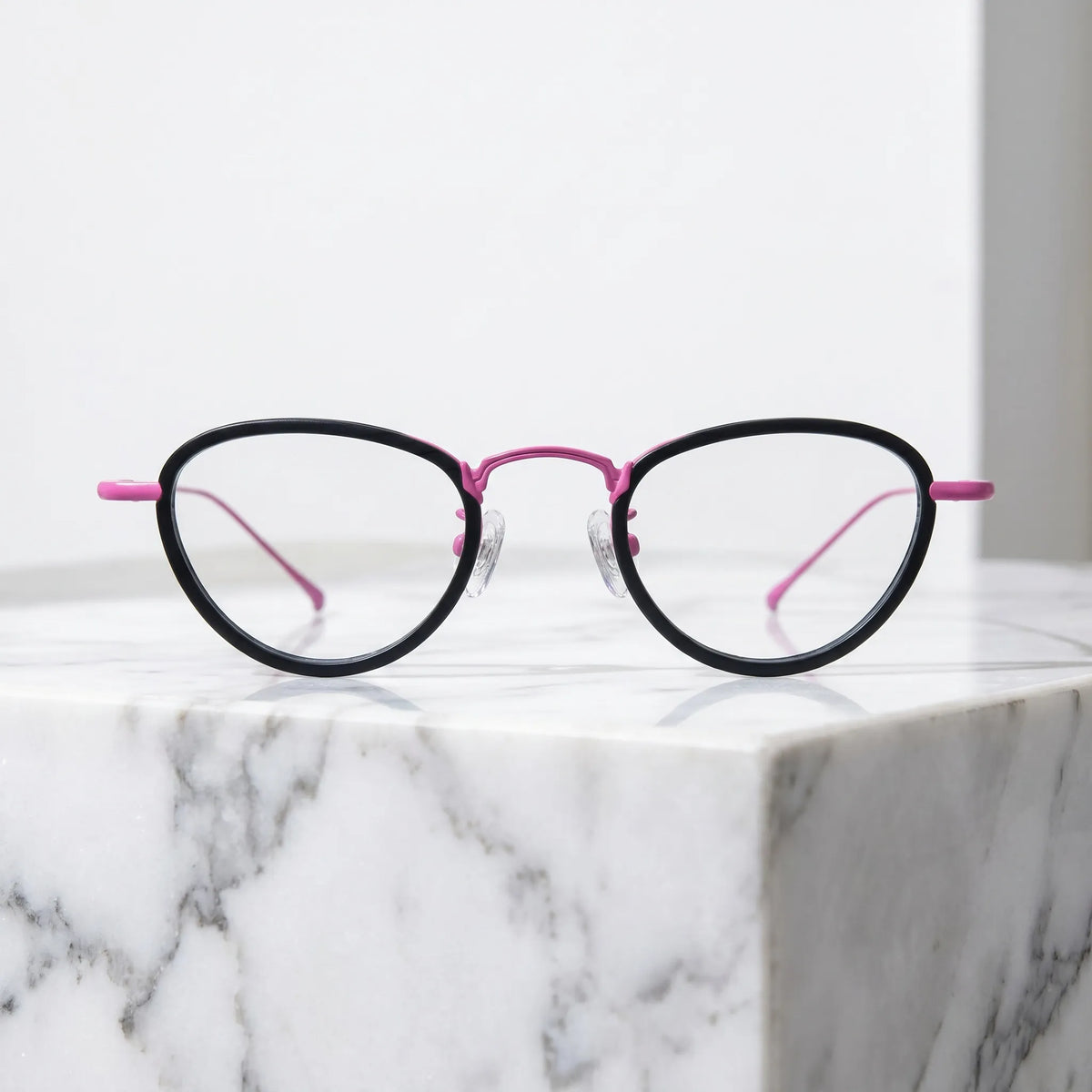 Barledear Midnight Rose eyeglasses shown in a clean lifestyle front view with black acetate front and rose titanium details