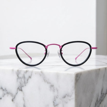 Barledear Midnight Rose eyeglasses shown in a clean lifestyle front view with black acetate front and rose titanium details