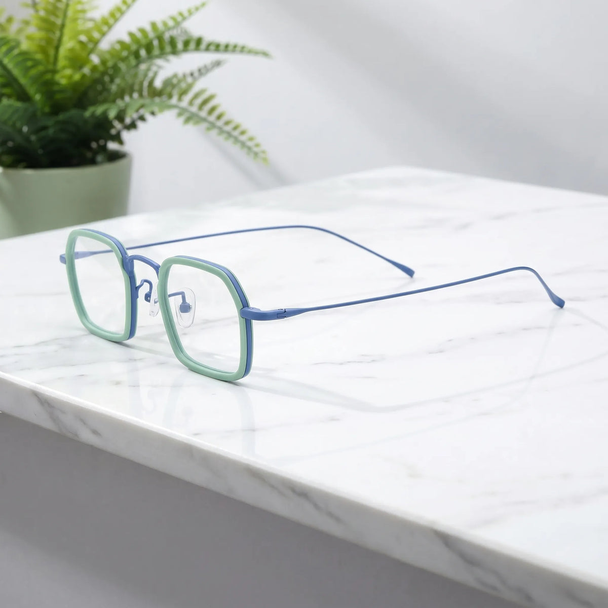 Barledear Mint Sky Blue eyeglasses angled side view showing slim titanium temples and bridge detail