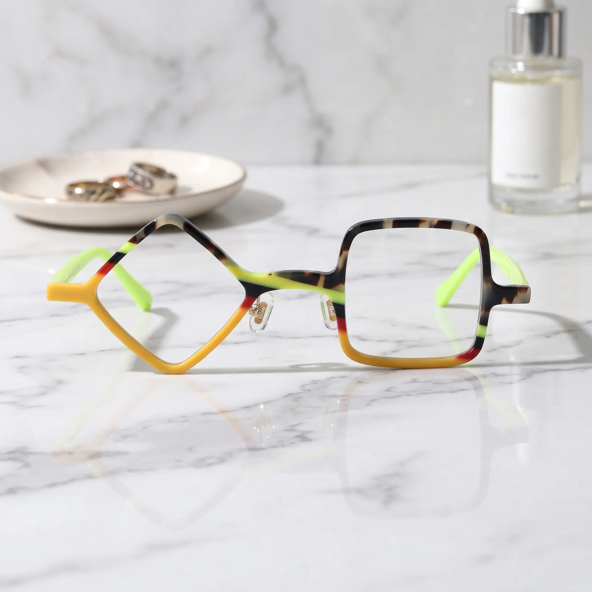 Barledear Neon Tortoise asymmetric geometric acetate eyeglasses shown in a clean lifestyle front display with yellow tortoiseshell details and vivid lime temples.