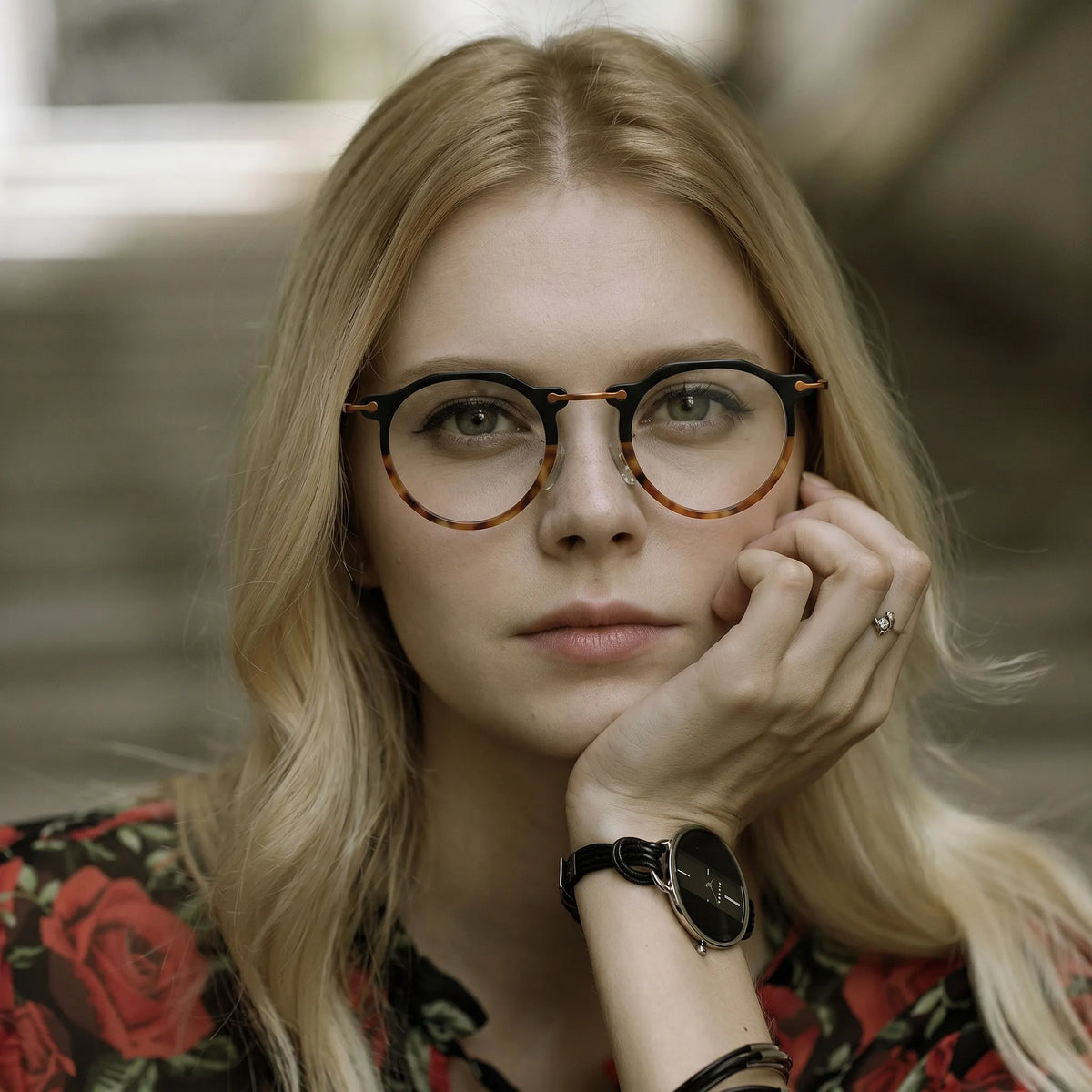 Model wearing Barledear Noir Amber eyeglasses in a lifestyle portrait showing the retro oval acetate metal frame