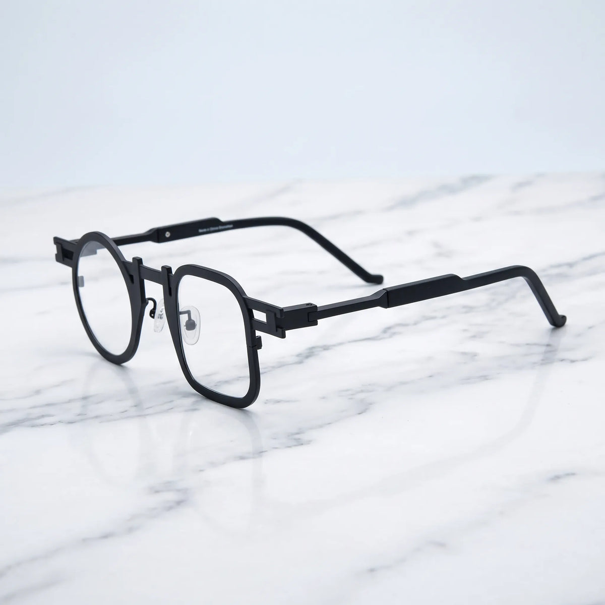 Barledear Obsidian Black eyeglasses angled side view showing slim temples, extended side-bar detail, and adjustable nose pads