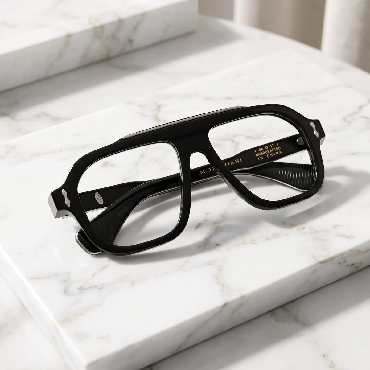 Barledear Obsidian Black eyeglasses folded display showing the thick acetate frame, black temples and silver-tone decorative inlays