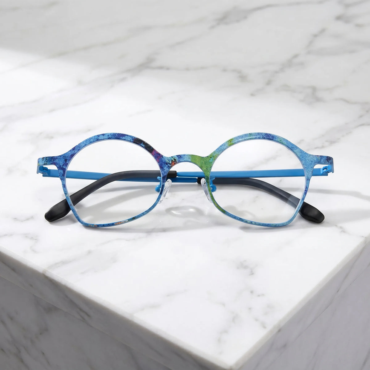 Barledear Ocean Bloom Blue eyeglasses folded display showing patterned titanium frame and slim temples
