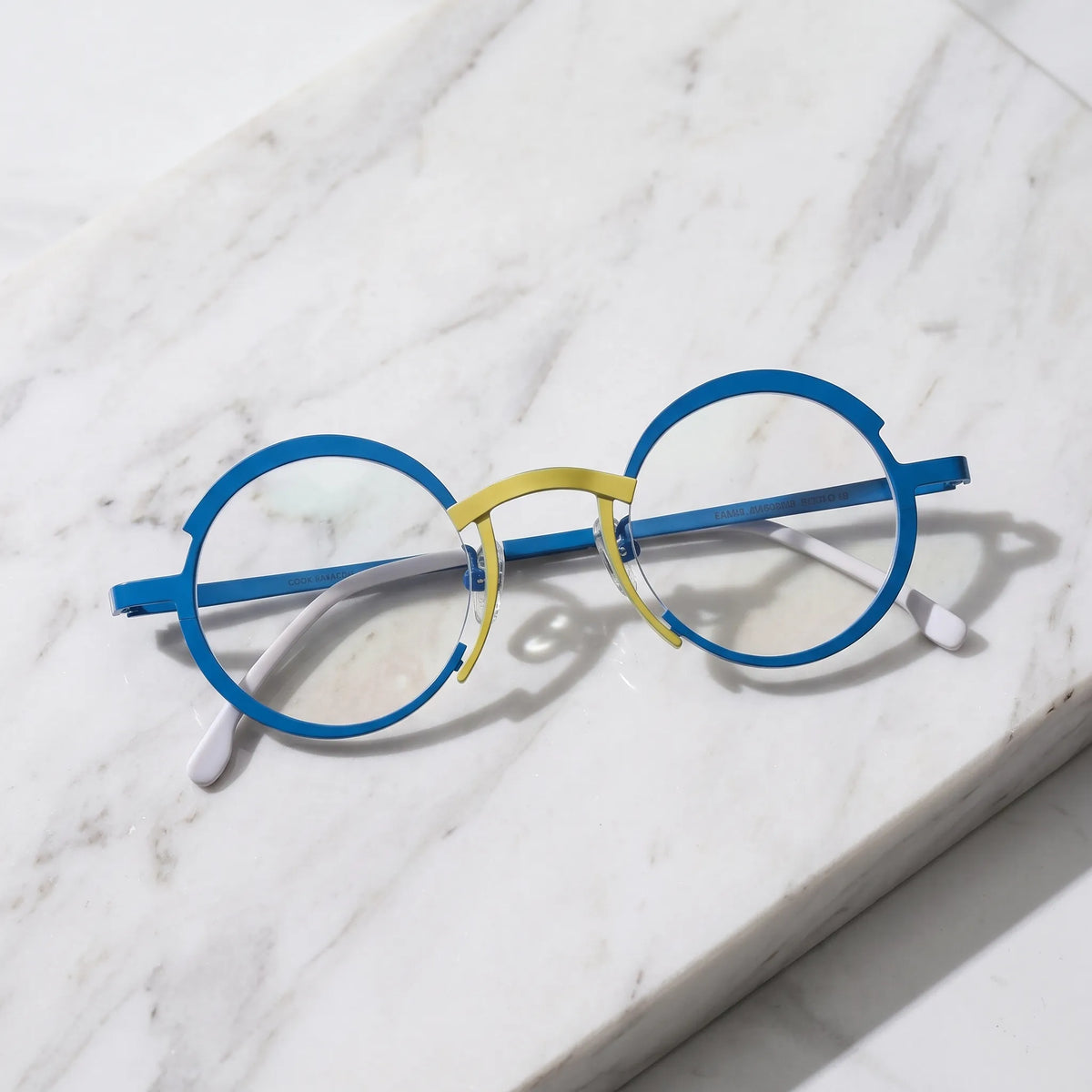 Barledear Ocean Blue Sunshine Yellow eyeglasses folded display showing the lightweight full-rim structure, slim titanium temples, and temple-tip details