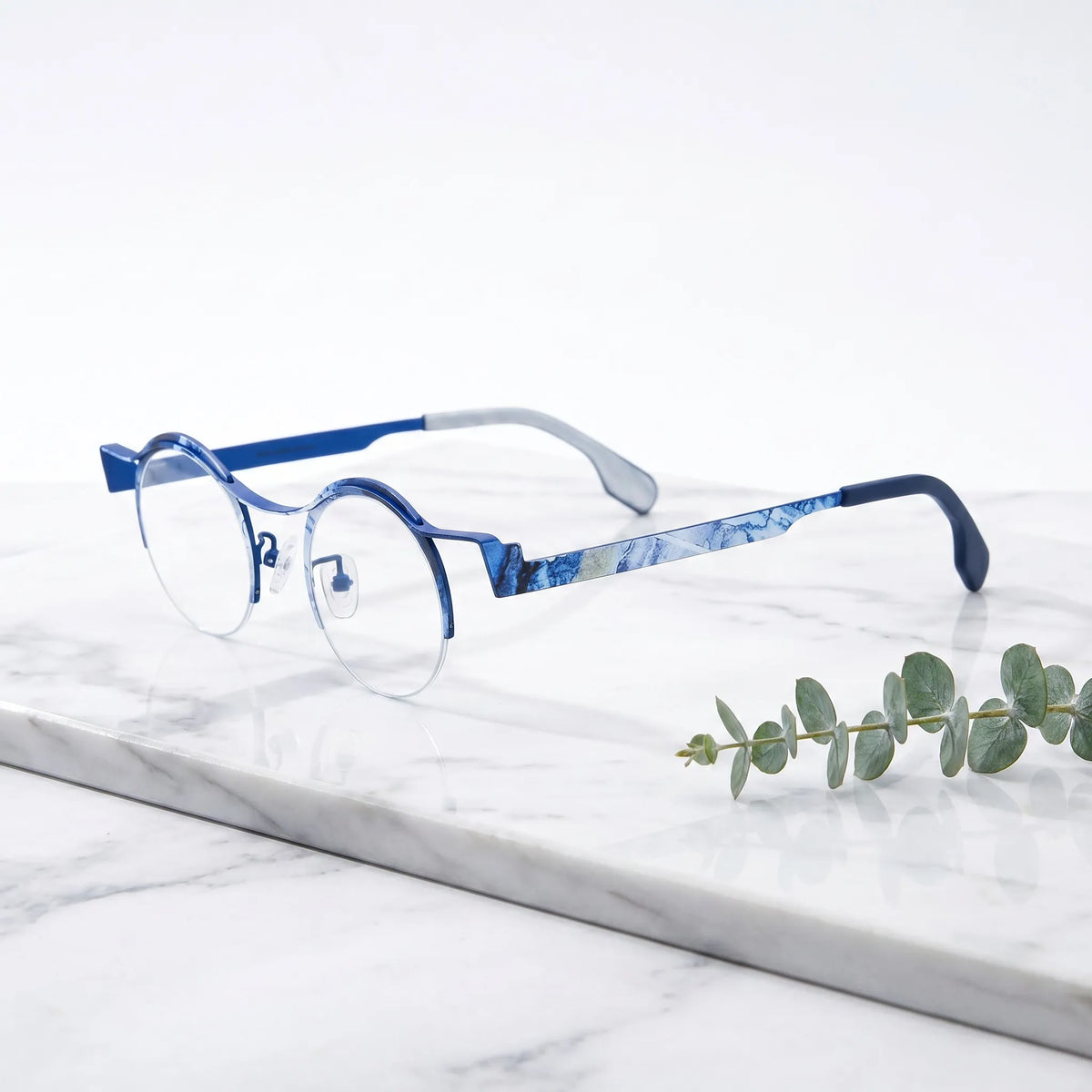 Barledear Ocean Marble eyeglasses angled side view showing blue temple details, round lenses, and semi-rimless frame structure
