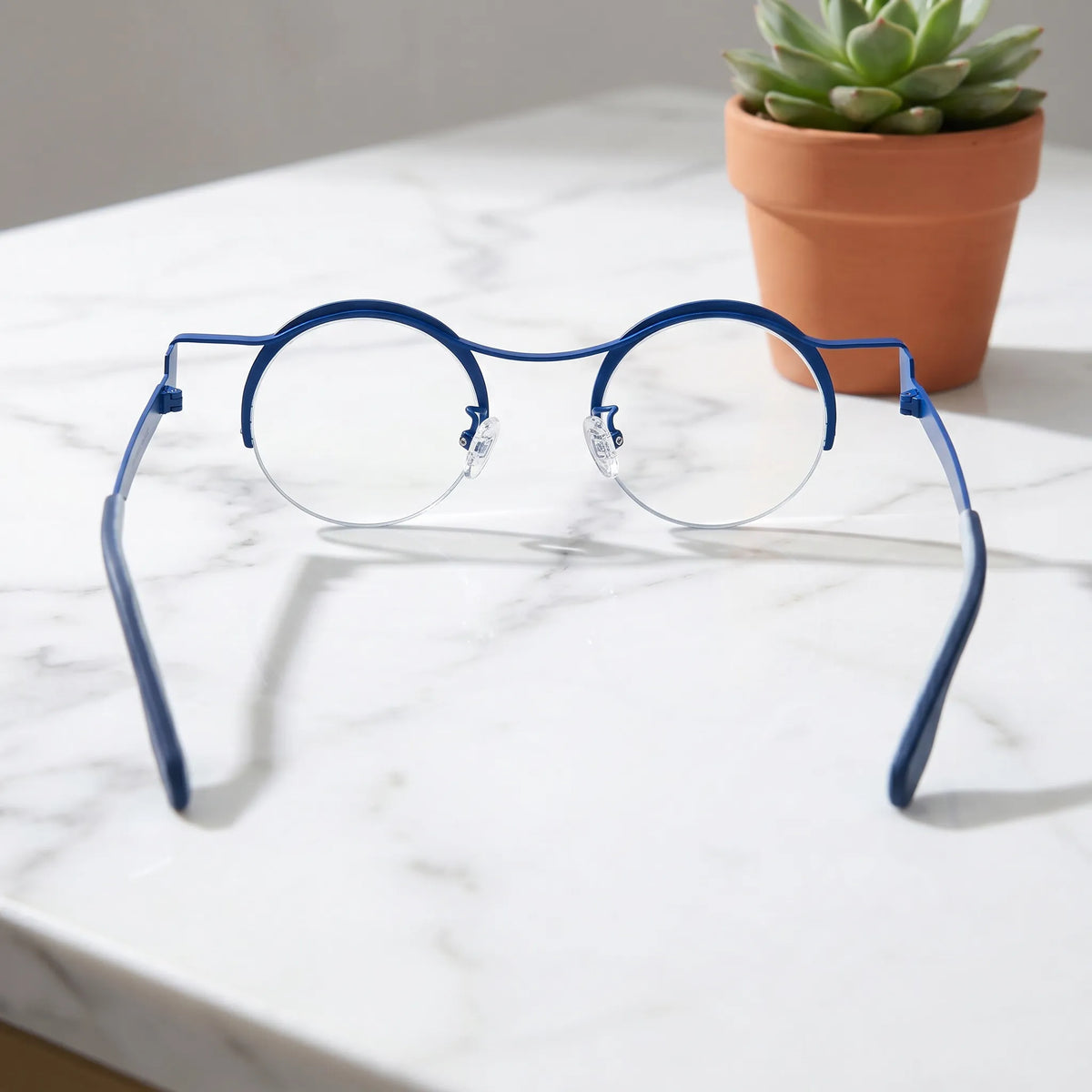 Barledear Ocean Marble eyeglasses back view showing adjustable nose pads, slim temples, and lightweight titanium frame construction