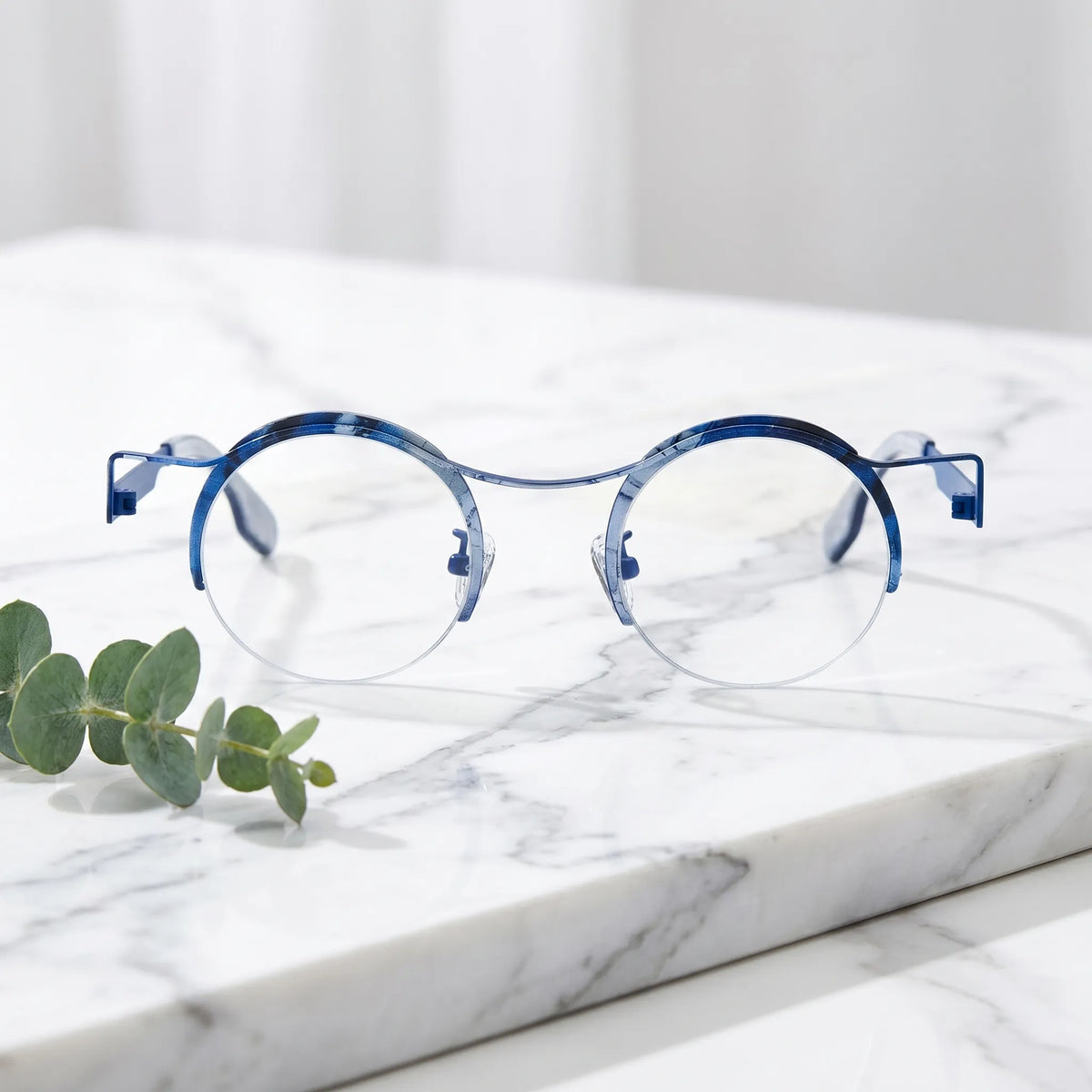 Barledear Ocean Marble eyeglasses shown in a clean lifestyle front view with blue marble details and retro round frame style