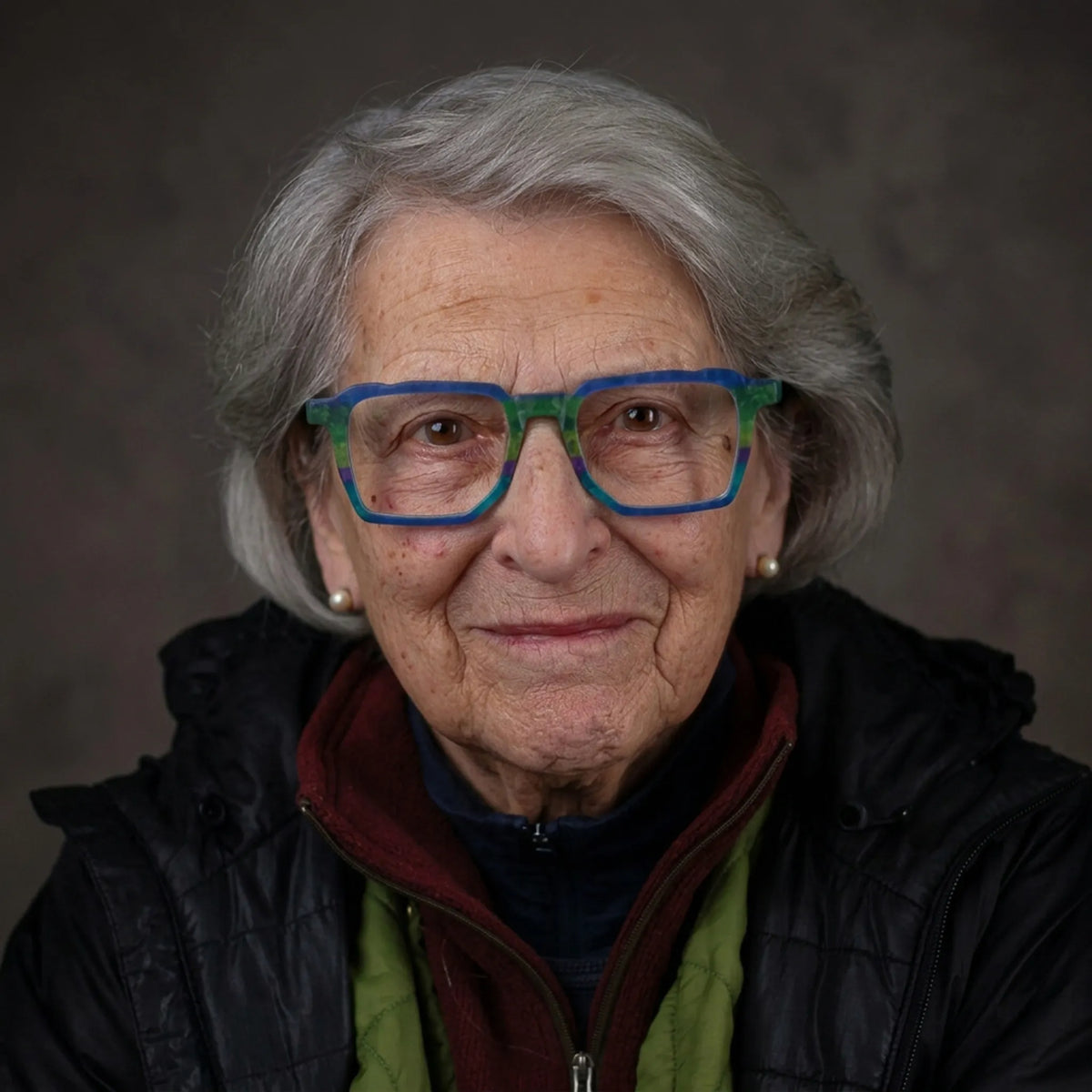 Model wearing Barledear Ocean Meadow blue green square acetate eyeglasses in a creative lifestyle portrait