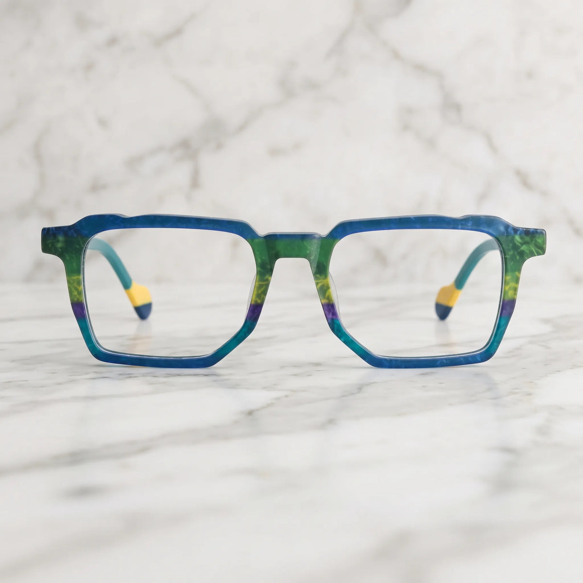 Barledear Ocean Meadow eyeglasses shown in a clean lifestyle setting with a blue green geometric square frame