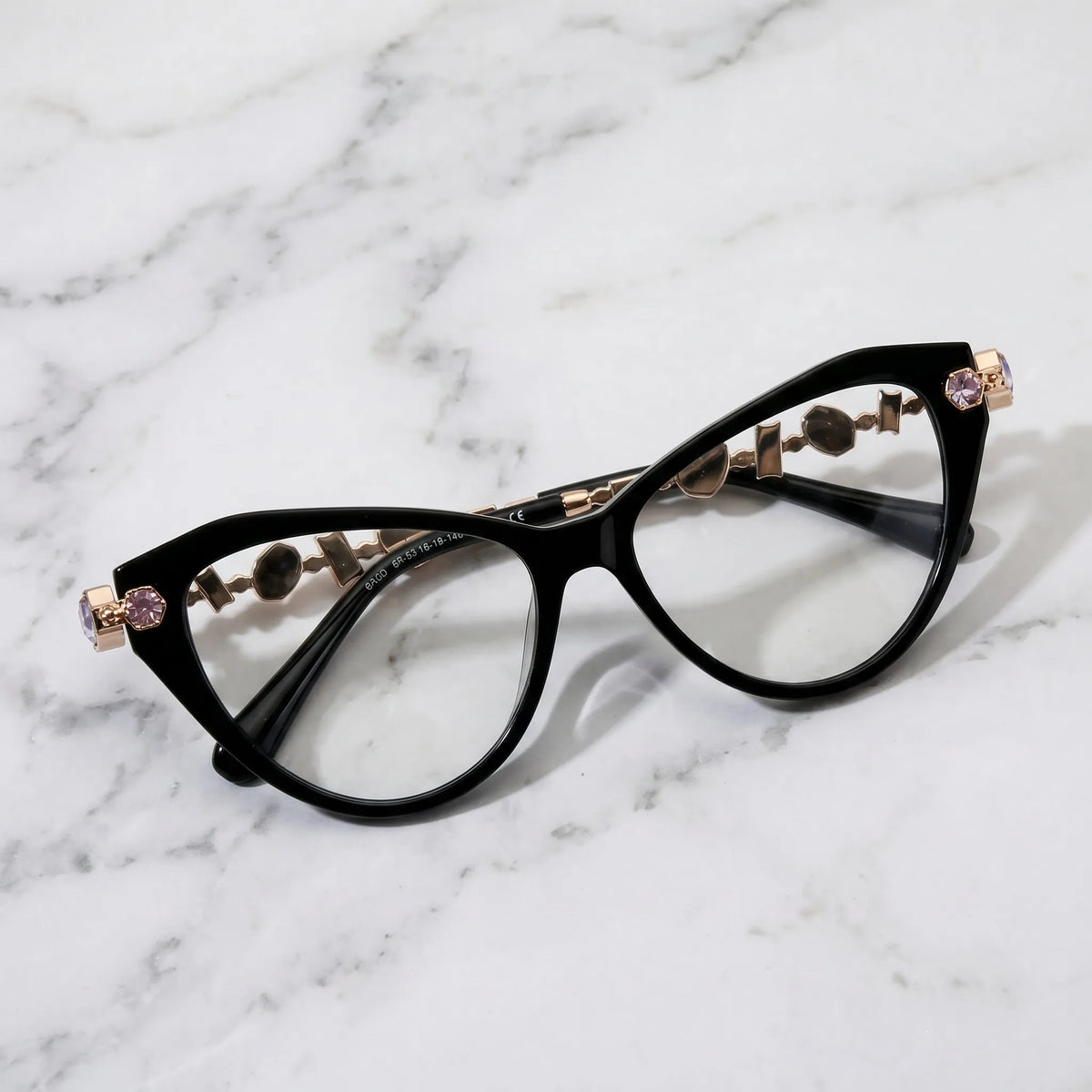 Barledear Onyx Black eyeglasses folded display showing the polished black acetate front, integrated nose bridge, and decorative metal temples