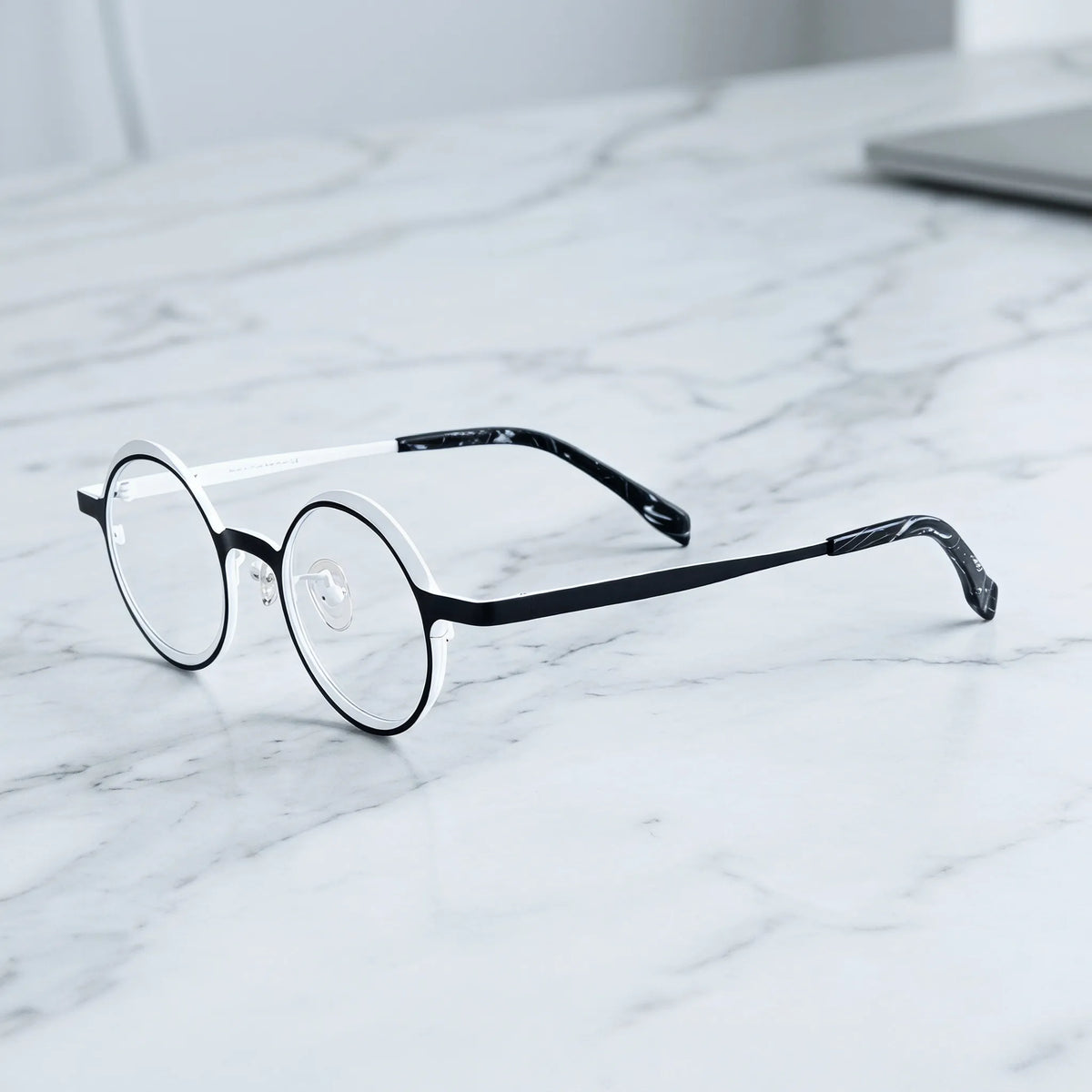 Barledear Onyx Crystal round pure titanium eyeglasses angled side view showing slim temples bridge construction and patterned temple tips