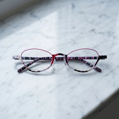Barledear Orchid Blush eyeglasses folded display showing pink patterned temples and full-rim oval frame