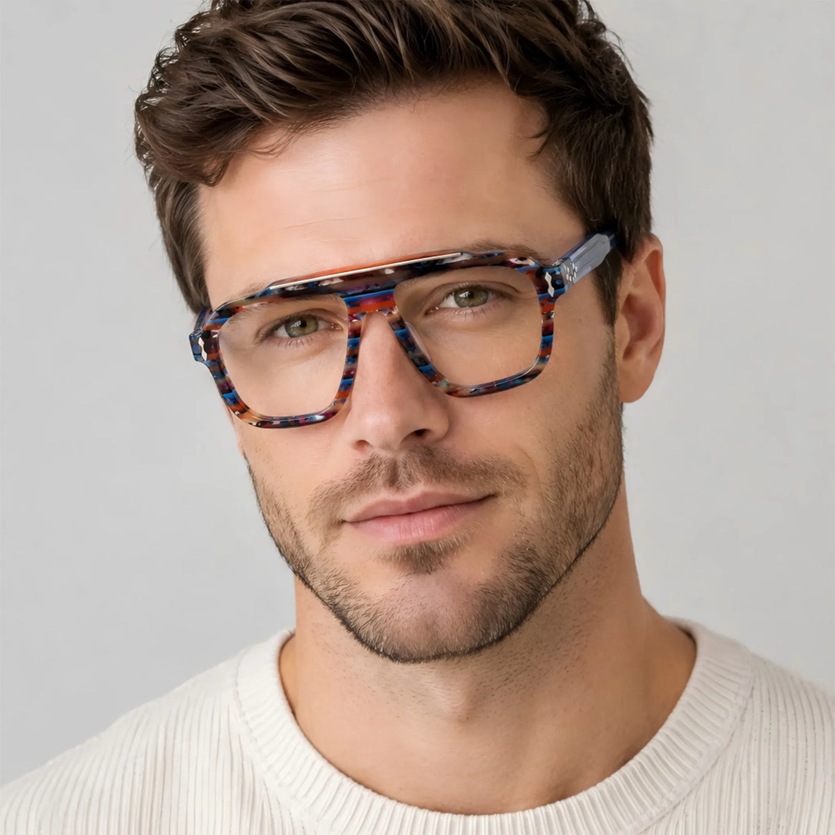 Adult model wearing Barledear Prism Blue Mosaic square aviator acetate eyeglasses for a bold colorful casual eyewear look