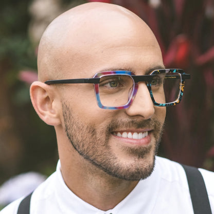 Model wearing Barledear Prism Mosaic Noir square eyeglasses in a modern lifestyle portrait