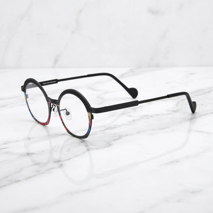 Barledear Prism Noir eyeglasses angled side view showing slim titanium temples, curved black temple tips, and colorful mosaic front detail