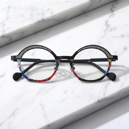 Barledear Prism Noir eyeglasses folded display showing slim black titanium temples, clear nose pads, and artistic geometric oval frame