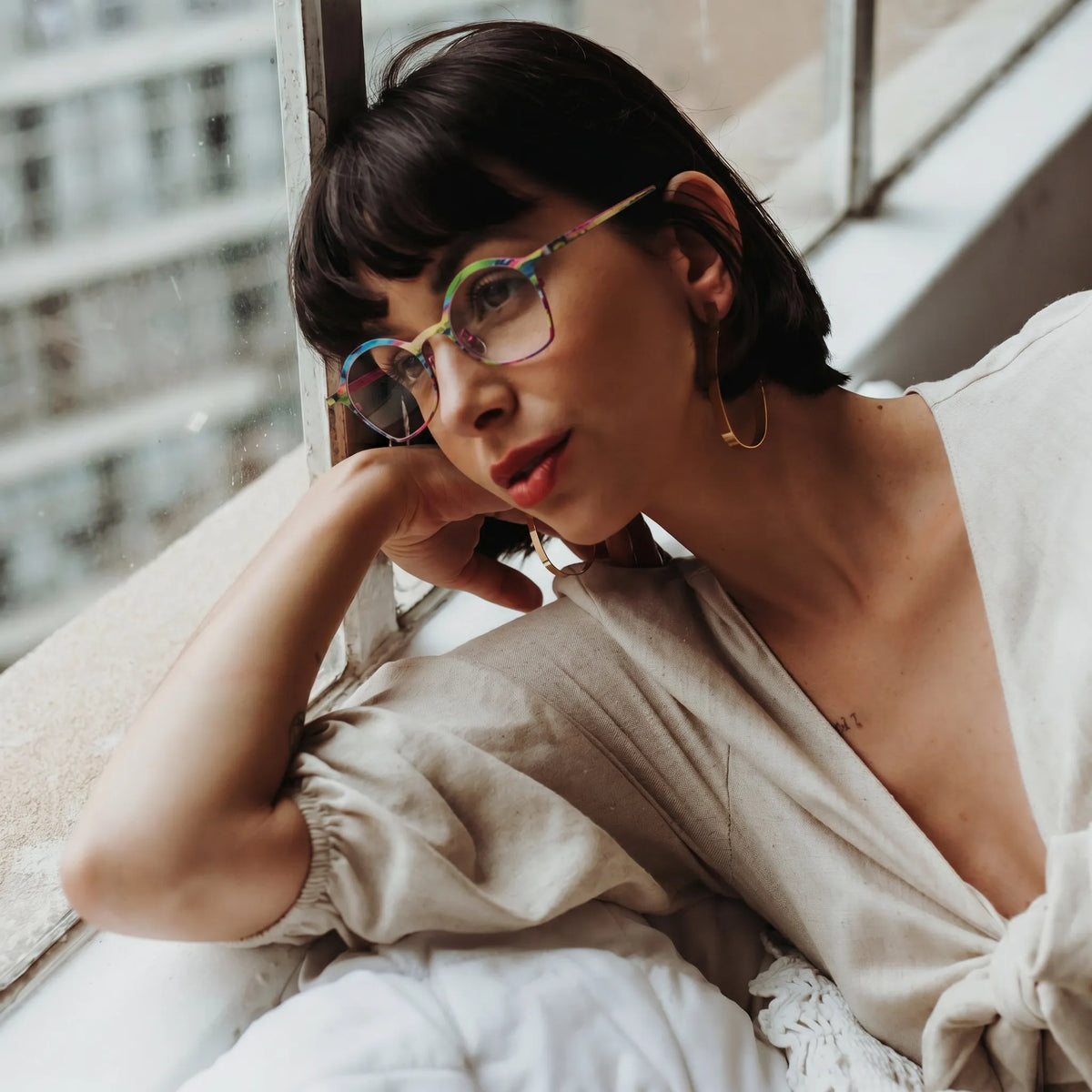 Model wearing Barledear Rose Meadow Pink eyeglasses in a lifestyle portrait
