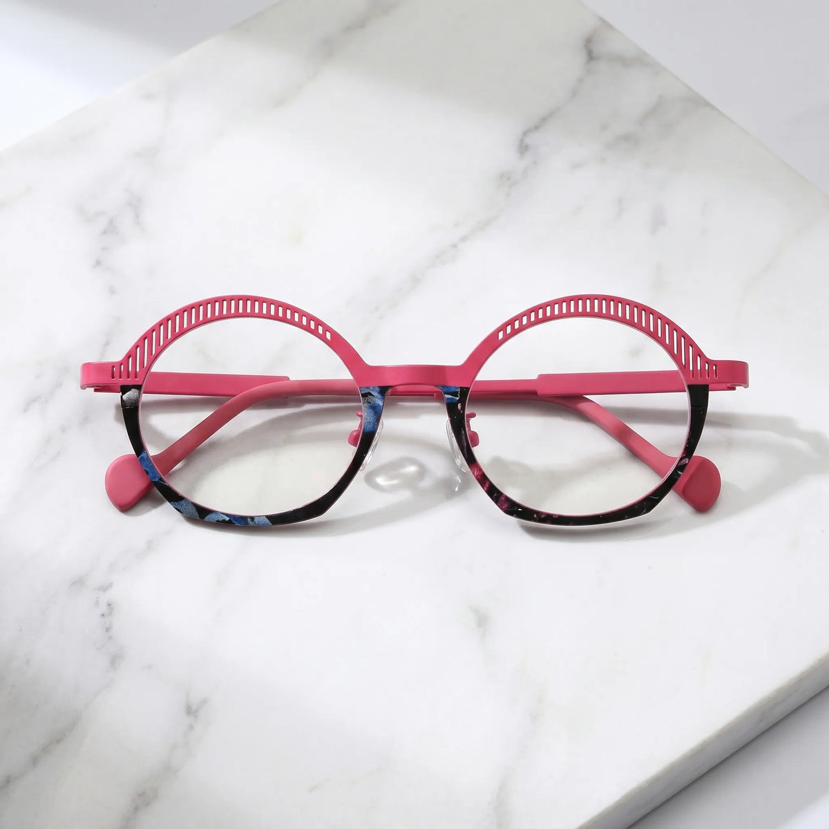Barledear Rose Mosaic eyeglasses folded display showing slim pink titanium temples, soft temple tips, and clear adjustable nose pads