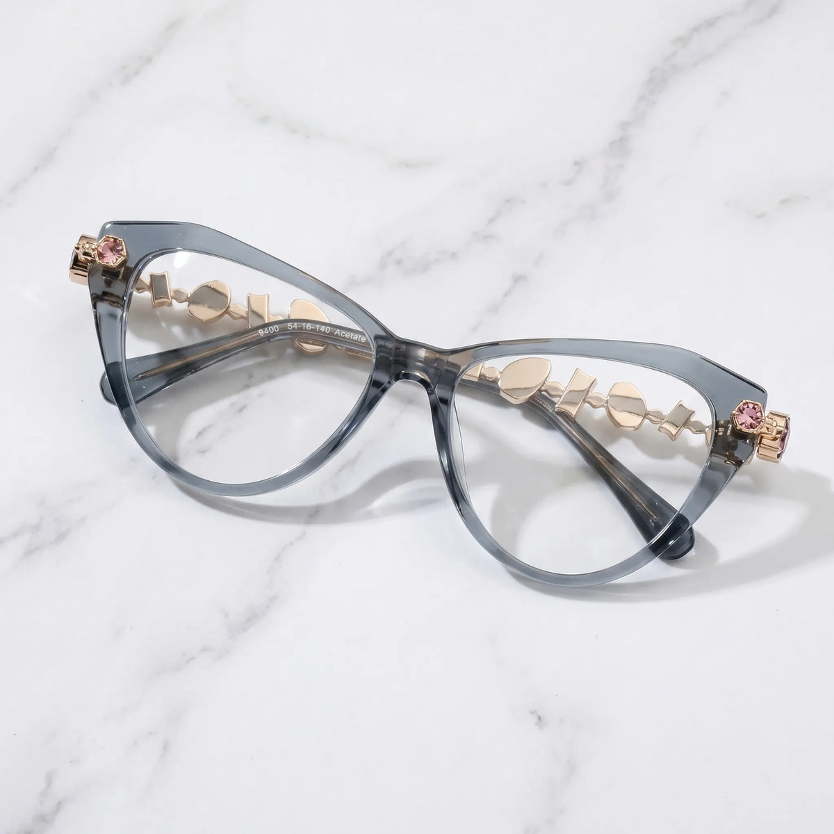 Barledear Smoke Quartz eyeglasses folded display showing the polished gray acetate front, integrated nose bridge, and decorative metal temples