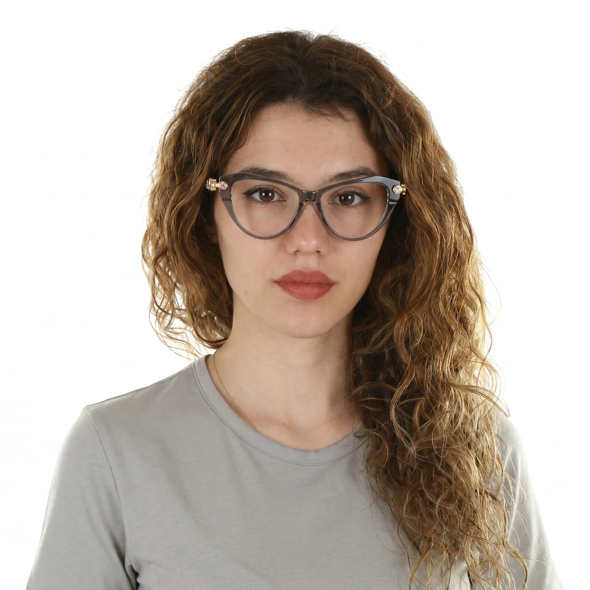 Adult woman wearing Barledear Smoke Quartz geometric cat-eye eyeglasses in a polished modern lifestyle portrait