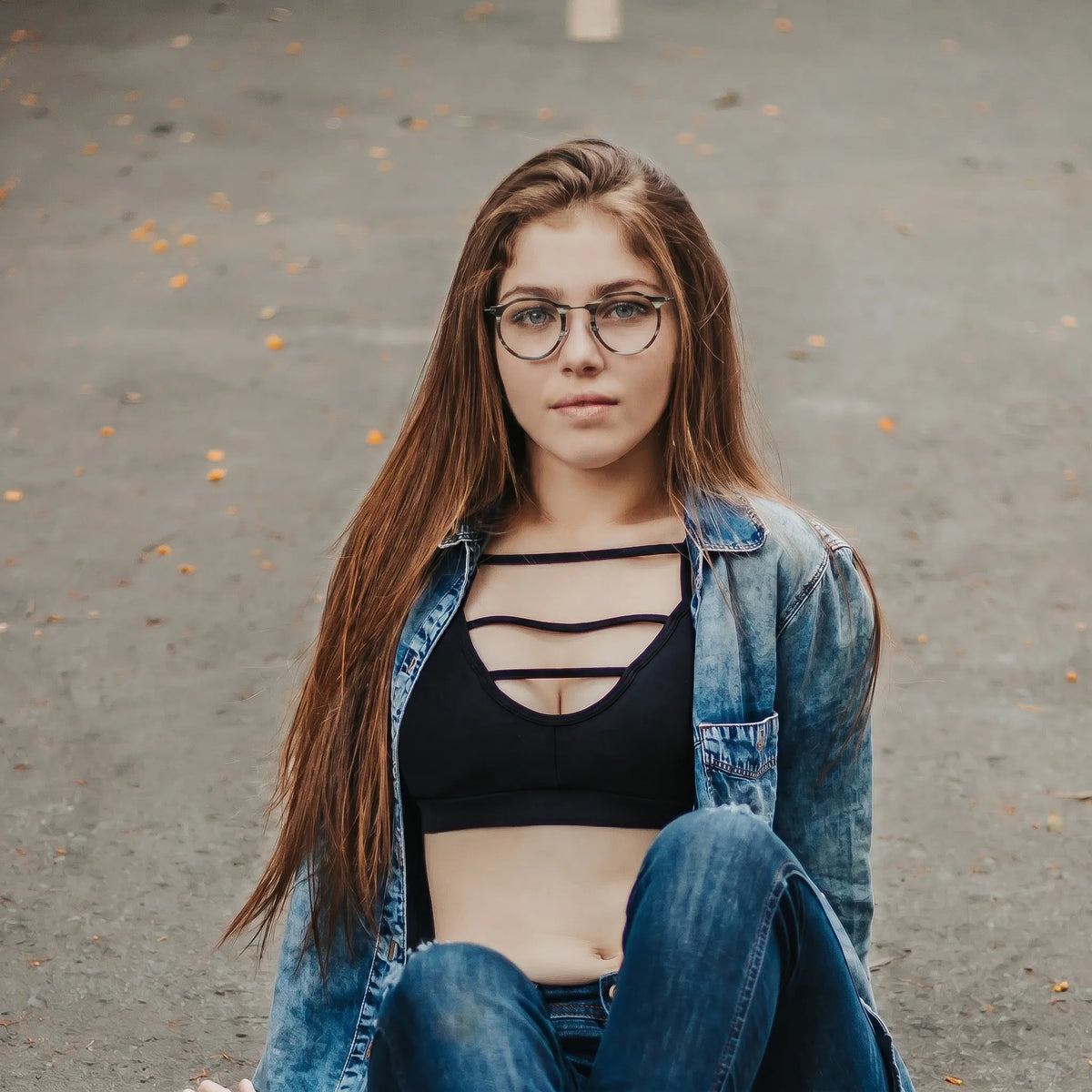 Model wearing Barledear Smoke Stripe eyeglasses in a lifestyle portrait showing the retro oval acetate metal frame