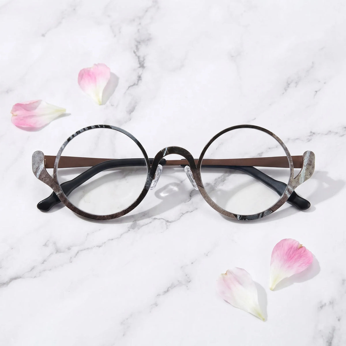 Barledear Smoky Cocoa eyeglasses folded display showing the round frame shape, slim temples, and artistic color-spliced pure titanium construction