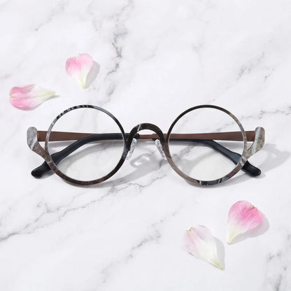 Barledear Smoky Cocoa eyeglasses folded display showing the round frame shape, slim temples, and artistic color-spliced pure titanium construction