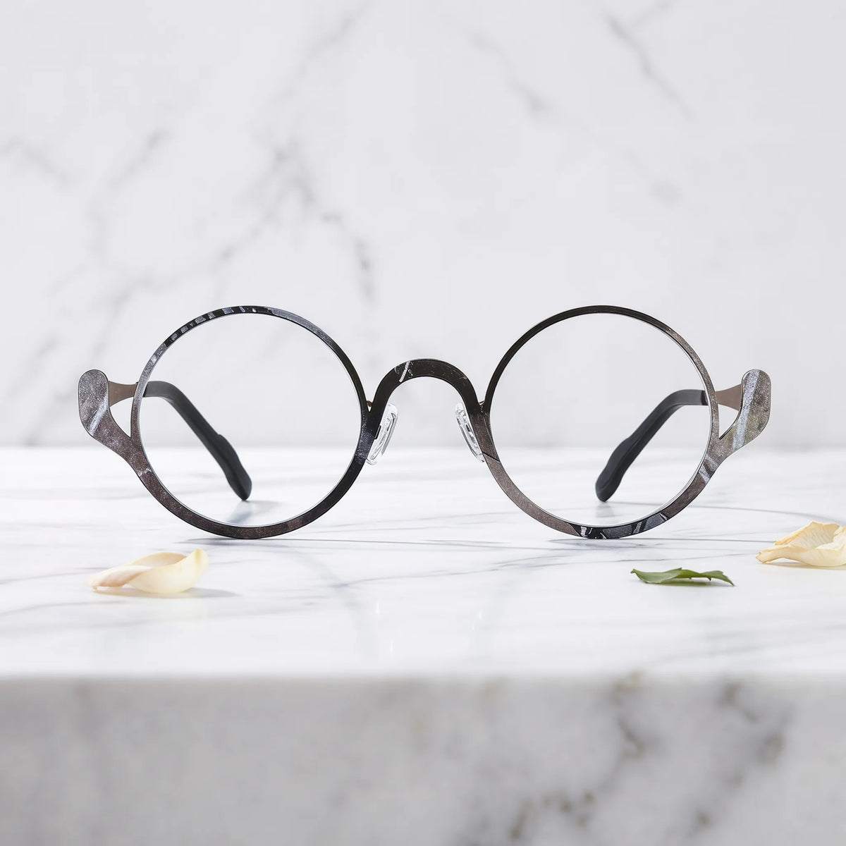 Barledear Smoky Cocoa eyeglasses shown in a clean lifestyle front view highlighting the artistic round pure titanium frame and modern everyday style