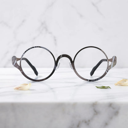 Barledear Smoky Cocoa eyeglasses shown in a clean lifestyle front view highlighting the artistic round pure titanium frame and modern everyday style