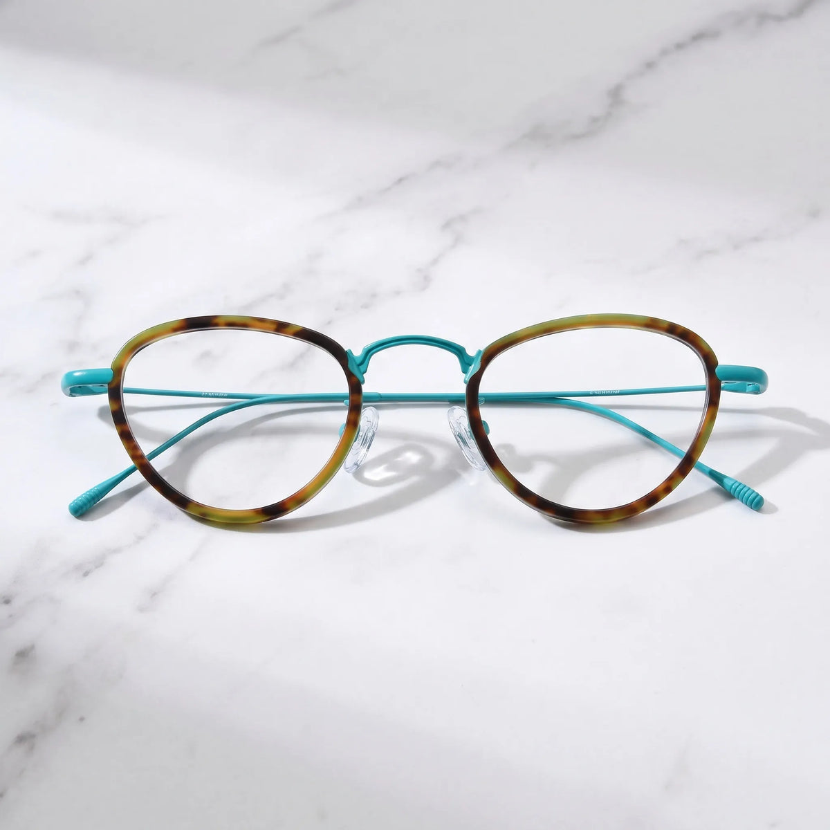 Barledear Sunlit Teal Tortoise eyeglasses folded display showing patterned acetate front and slim titanium temples