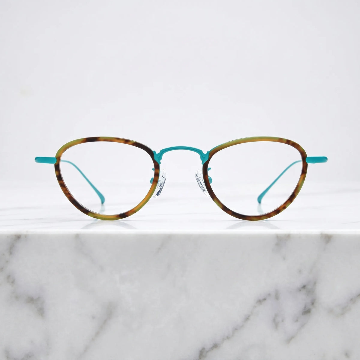 Barledear Sunlit Teal Tortoise eyeglasses shown in a clean lifestyle front view with teal titanium details