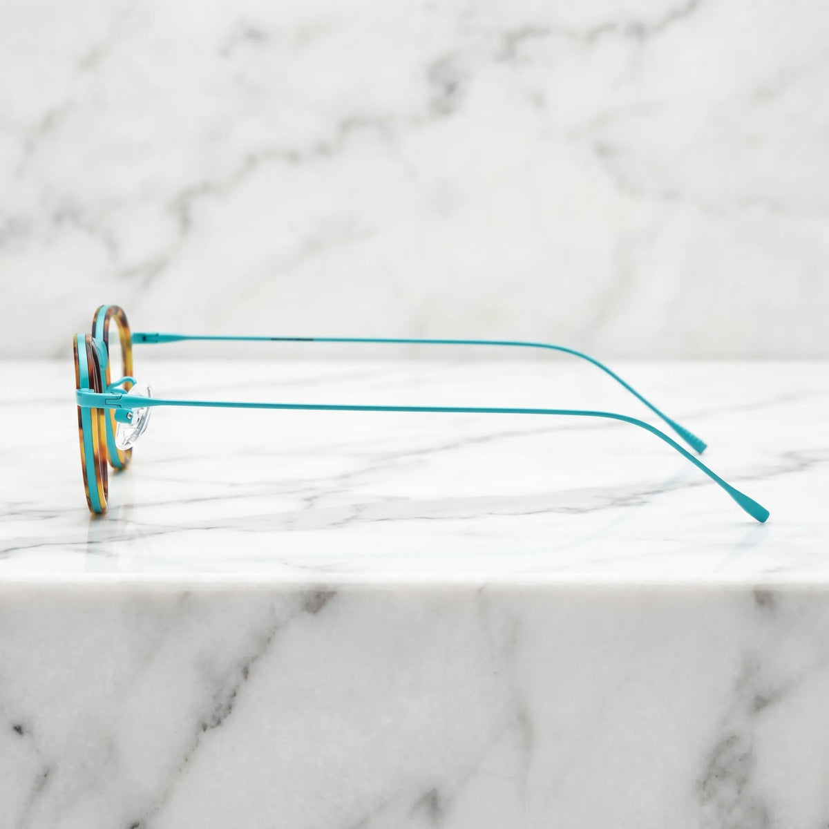 Barledear Sunlit Teal Tortoise eyeglasses angled side view showing slim temples bridge detail and adjustable nose pads