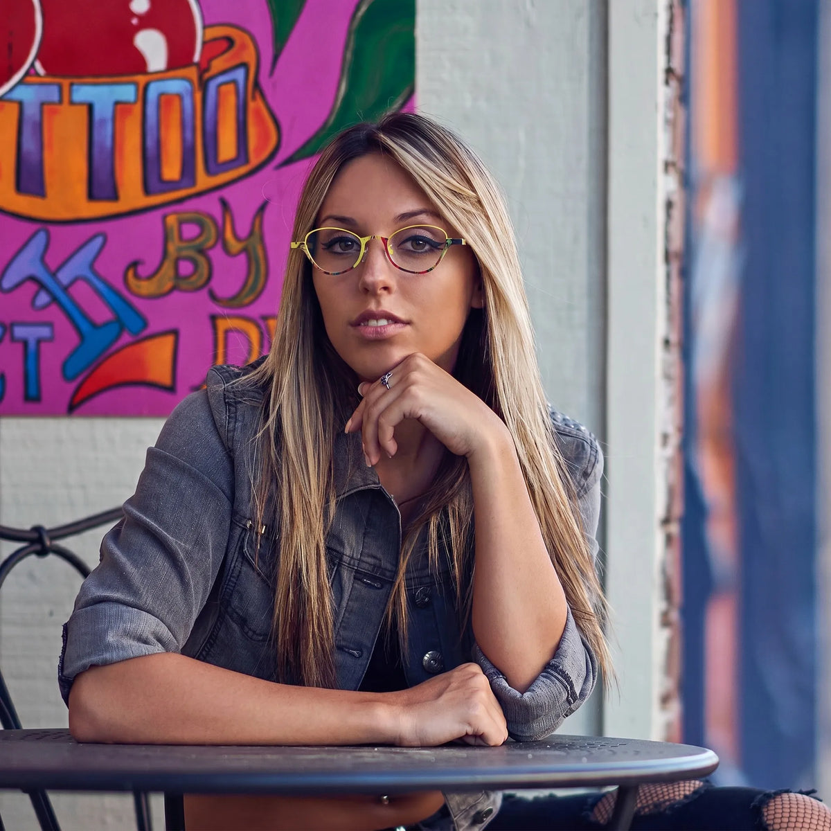 Model wearing Barledear Sunshine Mosaic oval titanium eyeglasses in a lifestyle portrait