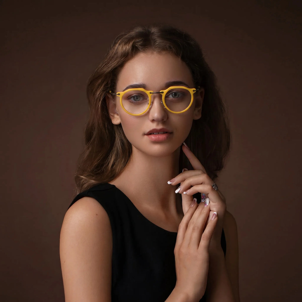 Model wearing Barledear Sunshine Yellow eyeglasses in a lifestyle portrait showing the retro oval acetate metal frame