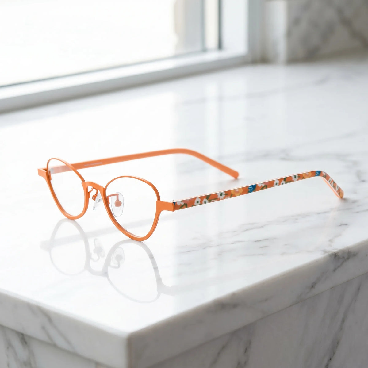 Barledear Tangerine Bloom eyeglasses angled side view showing orange temples clear nose pads and bridge detail