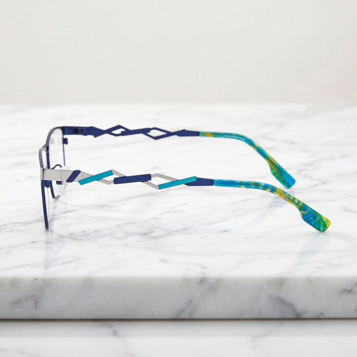 Barledear Titan Sky Blue eyeglasses angled side view showing futuristic geometric cutout temples and slim bridge detail