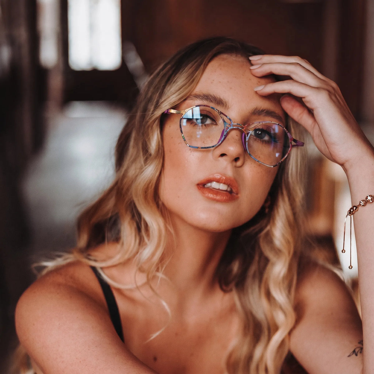 Model wearing Barledear Violet Aura Purple eyeglasses in a lifestyle portrait