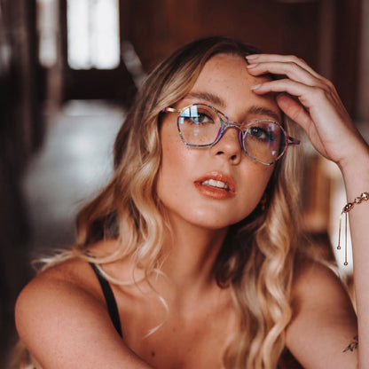 Model wearing Barledear Violet Aura Purple eyeglasses in a lifestyle portrait