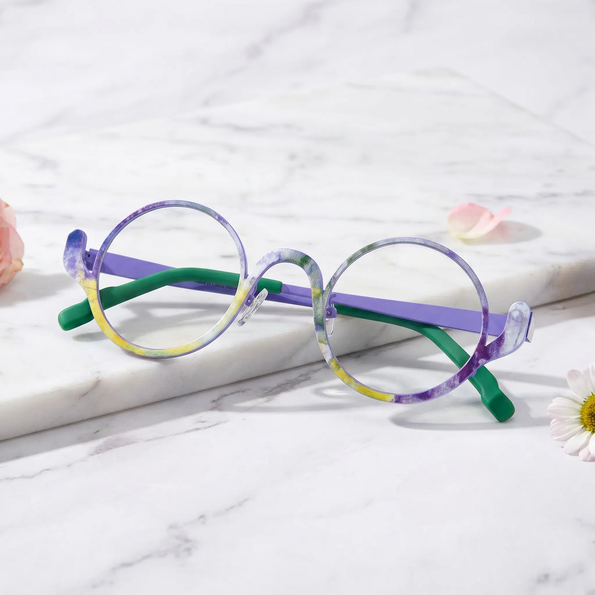 Barledear Violet Meadow eyeglasses folded display showing the round frame shape, slim temples, and artistic color-spliced pure titanium construction