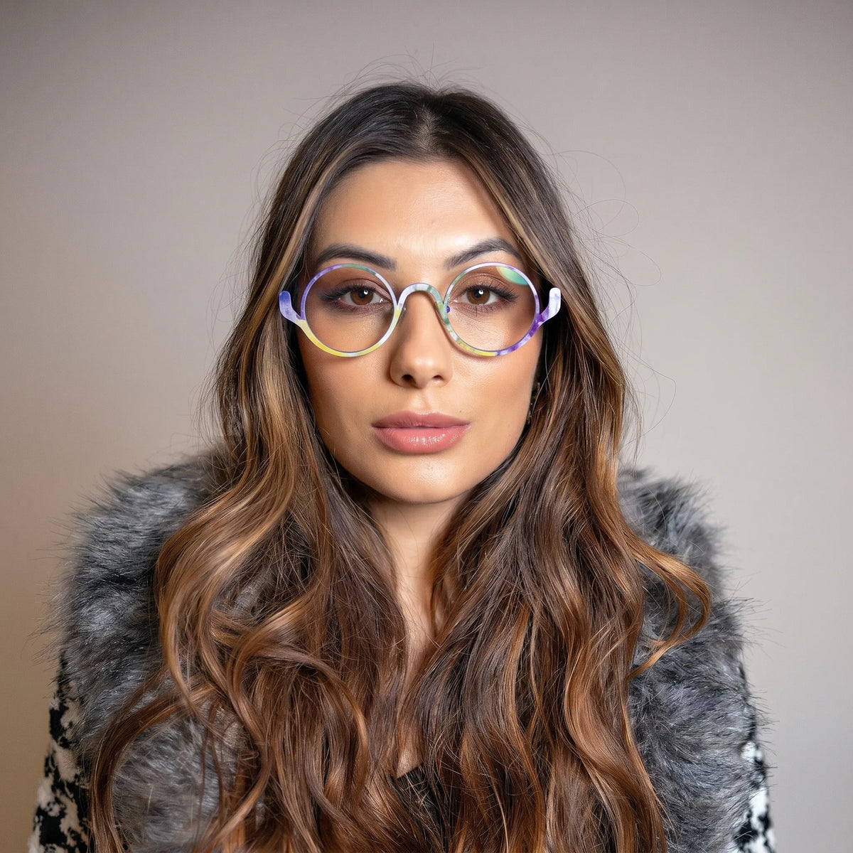 Model wearing Barledear Violet Meadow eyeglasses in a lifestyle portrait showing the artistic round pure titanium frame on the face
