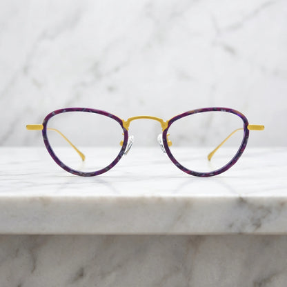 Barledear Violet Sunshine eyeglasses shown in a clean lifestyle front view with violet patterned acetate and yellow titanium details